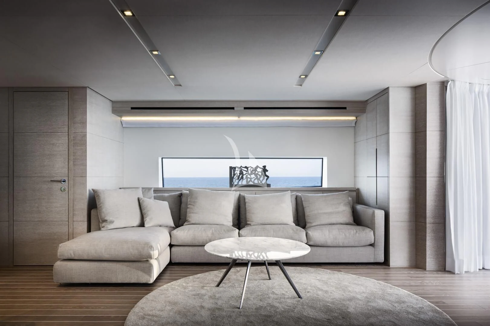 a living room with a couch and a table aboard TINY WAVE Yacht for Sale