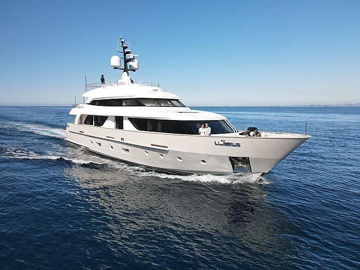 a white yacht on the water aboard TINY WAVE Yacht for Sale