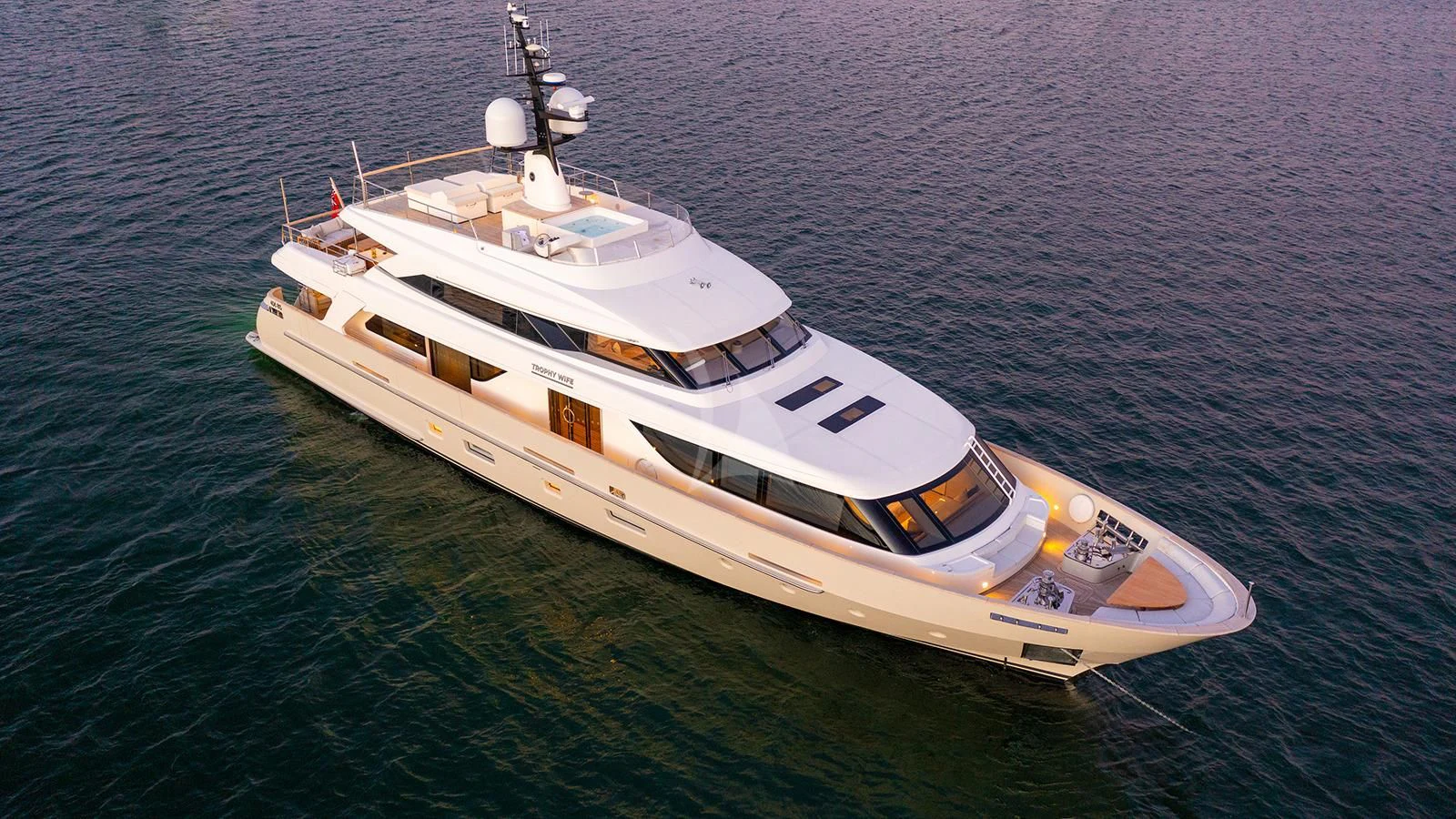 a white and black ship on the water aboard TINY WAVE Yacht for Sale