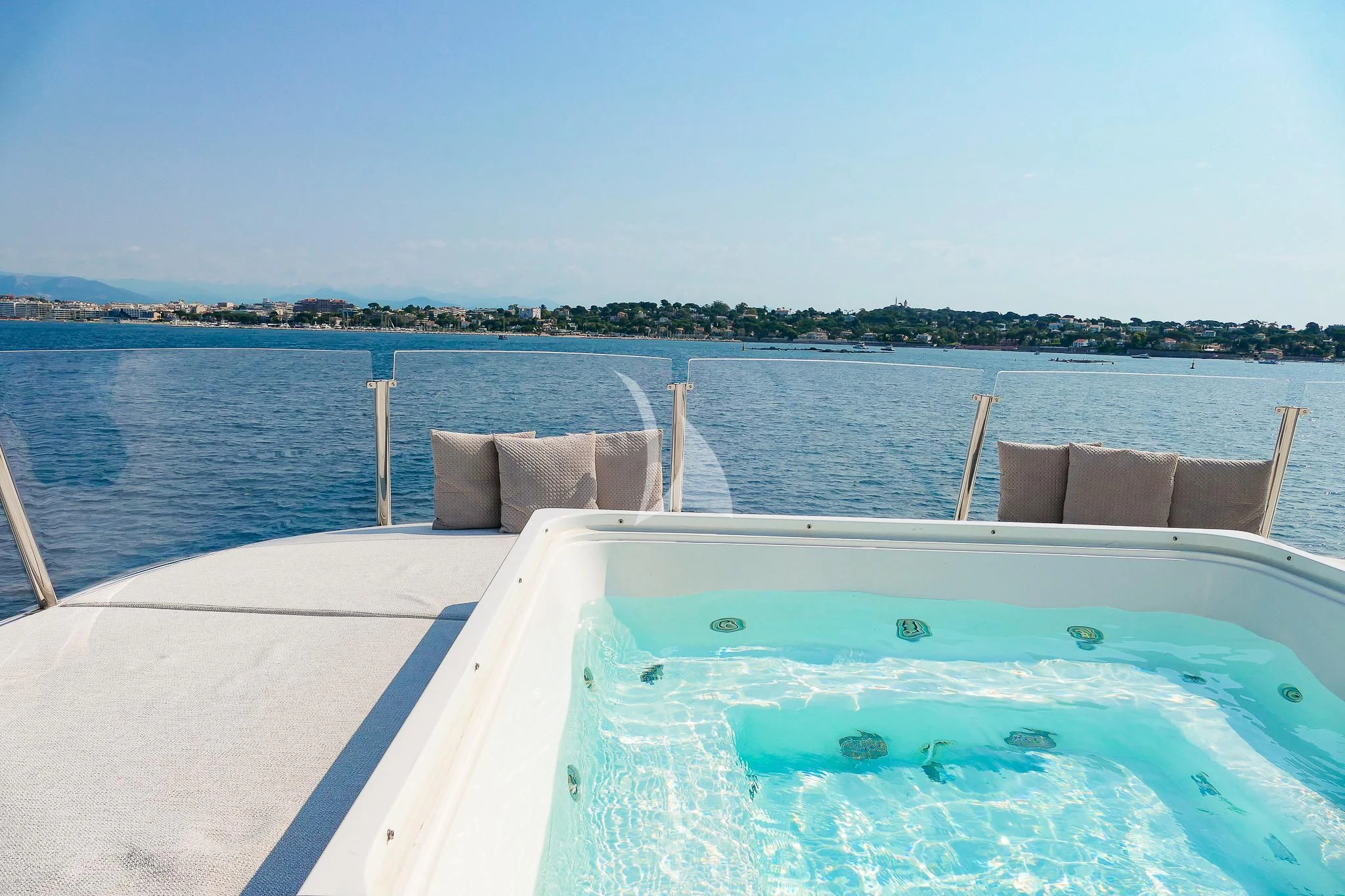 a pool with chairs and a table on the deck aboard TINY WAVE Yacht for Sale