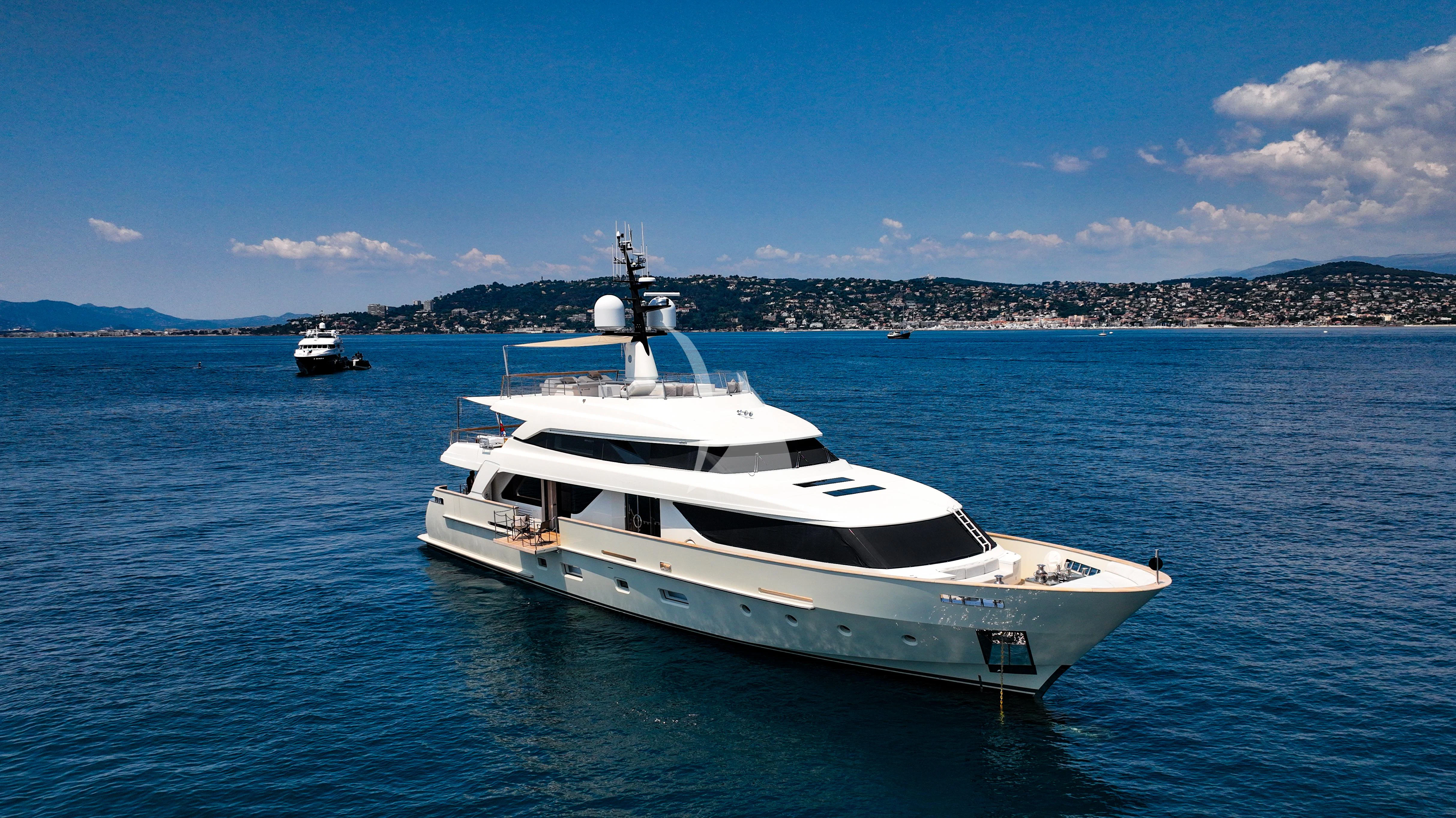a white yacht in the water aboard TINY WAVE Yacht for Sale