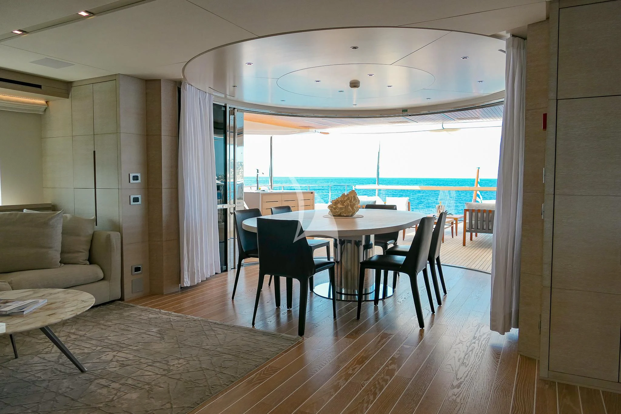 a room with a table and chairs aboard TINY WAVE Yacht for Sale