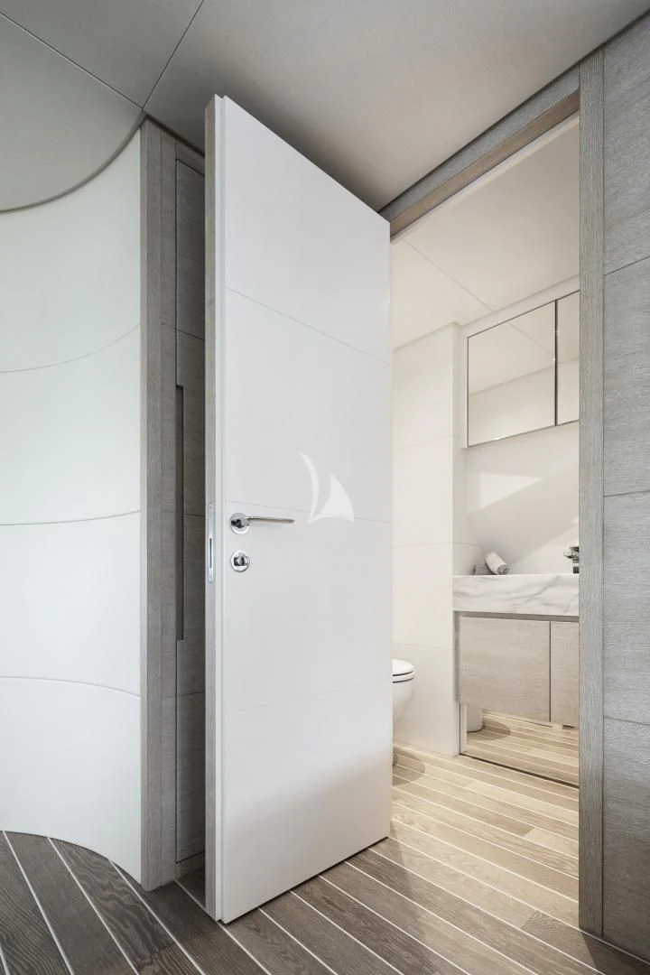 a white door in a bathroom aboard TINY WAVE Yacht for Sale
