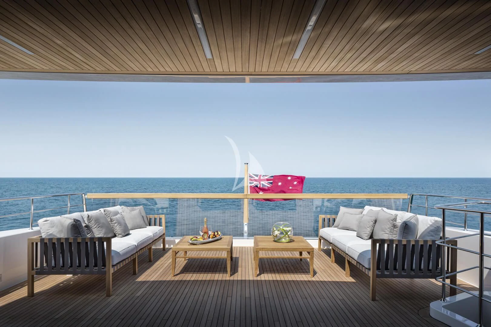 a deck with a view of the ocean and a deck aboard TINY WAVE Yacht for Sale