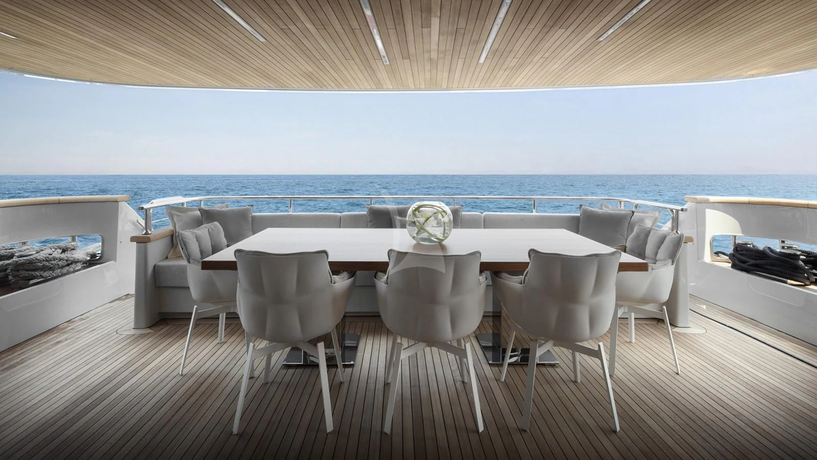 a table with chairs on it aboard TINY WAVE Yacht for Sale