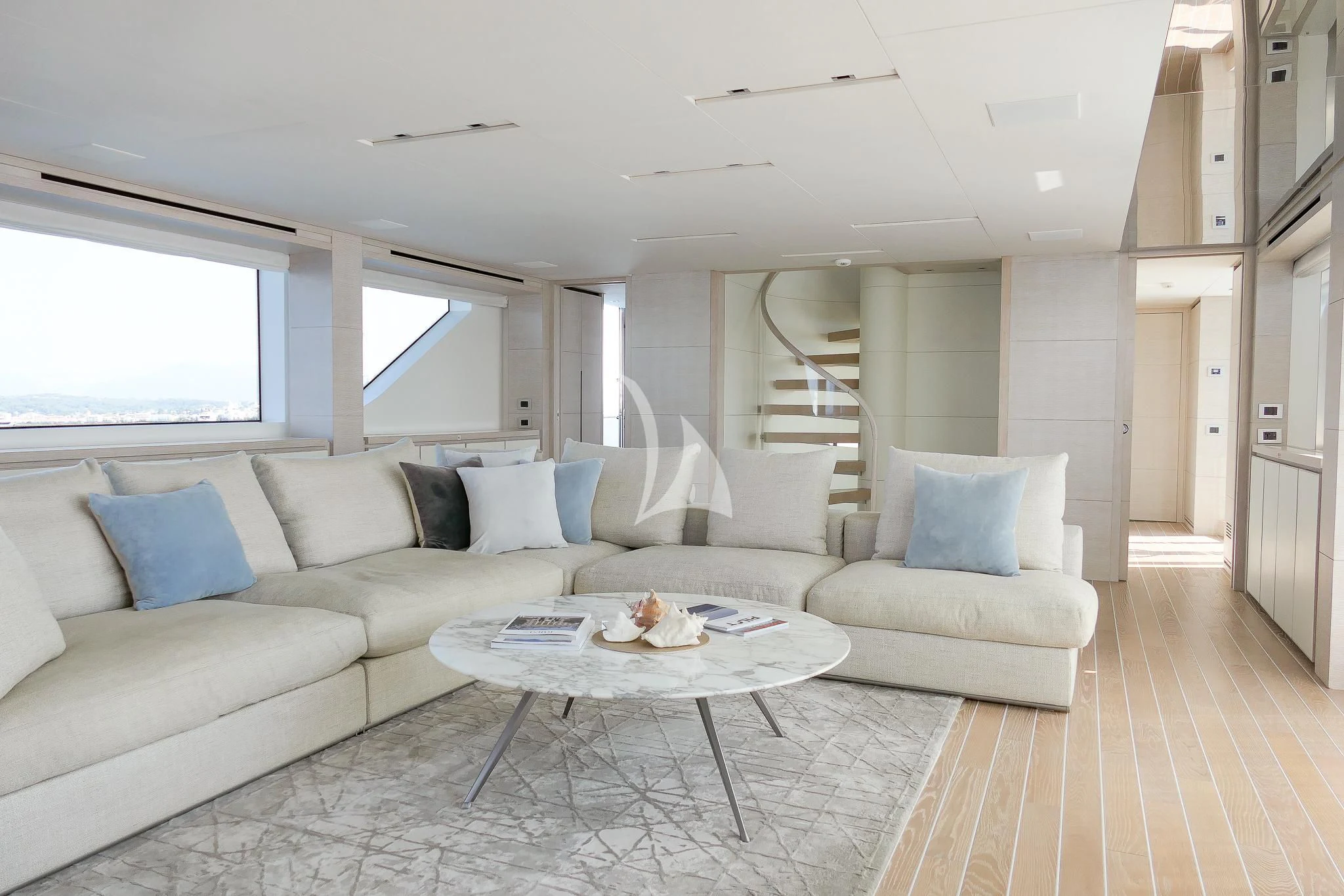 a living room with a couch and a table aboard TINY WAVE Yacht for Sale