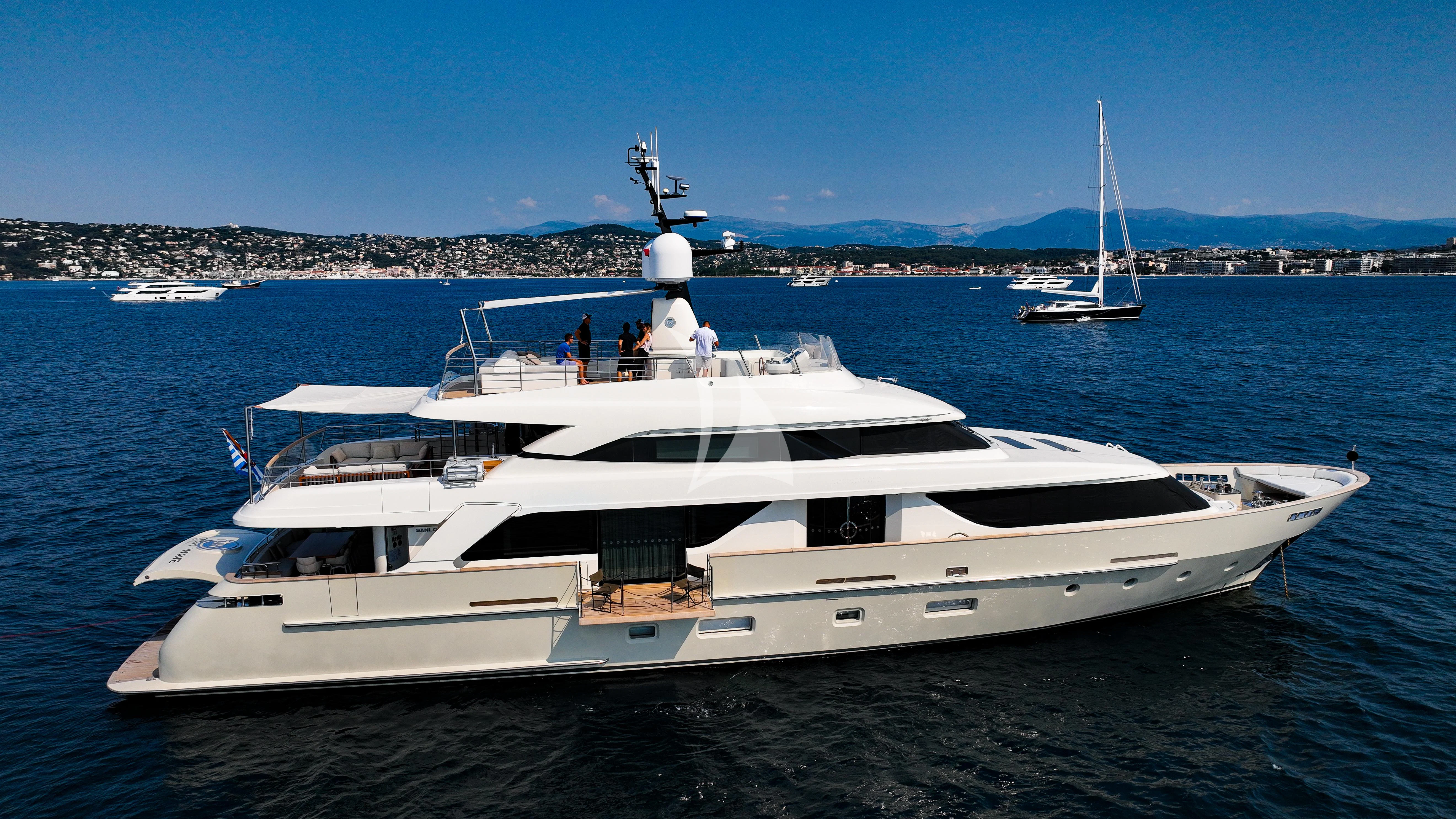 a white yacht on the water aboard TINY WAVE Yacht for Sale