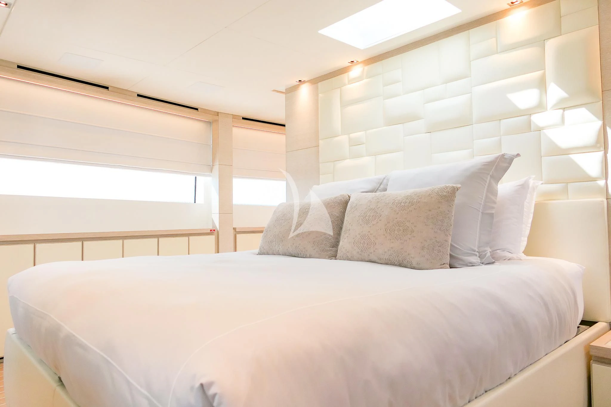 a bed with white sheets aboard TINY WAVE Yacht for Sale