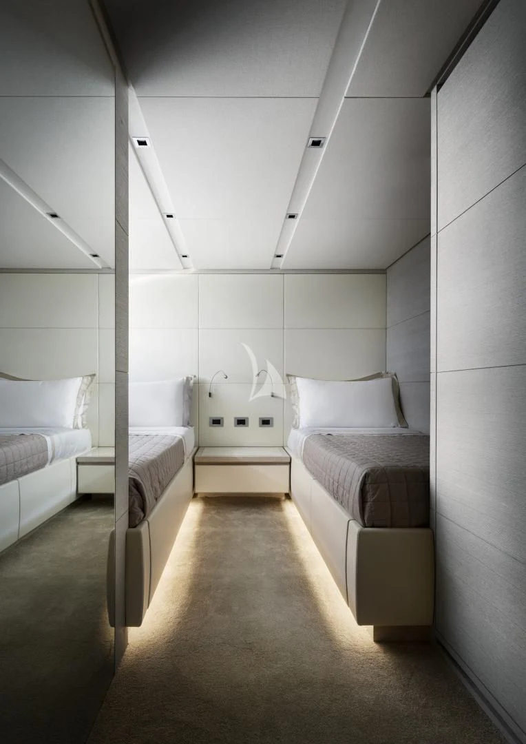 a room with a bed and a white wall aboard TINY WAVE Yacht for Sale