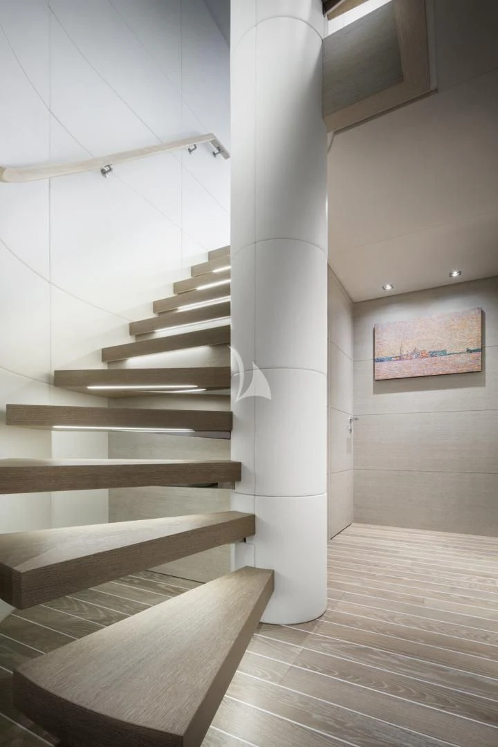 a staircase in a building aboard TINY WAVE Yacht for Sale