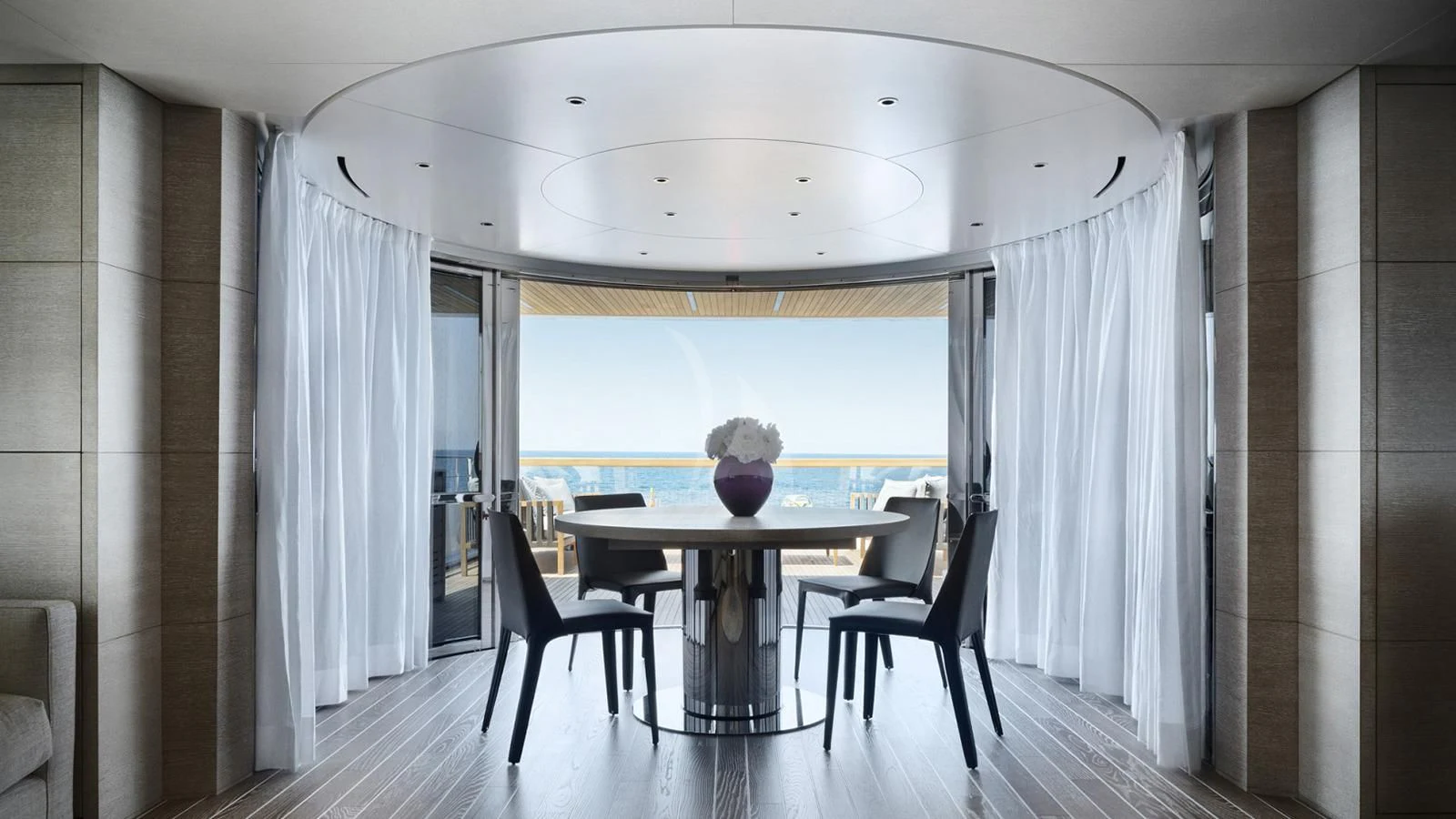 a room with a table and chairs aboard TINY WAVE Yacht for Sale