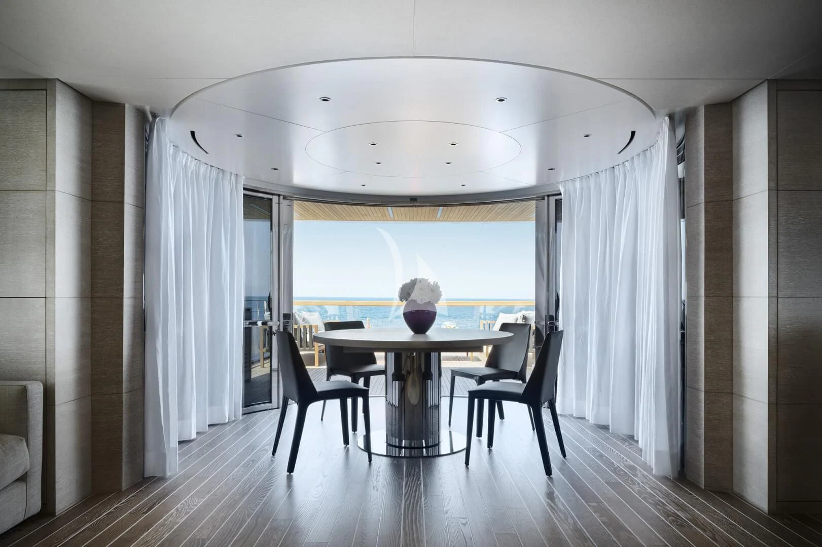 a room with a table and chairs aboard TINY WAVE Yacht for Sale