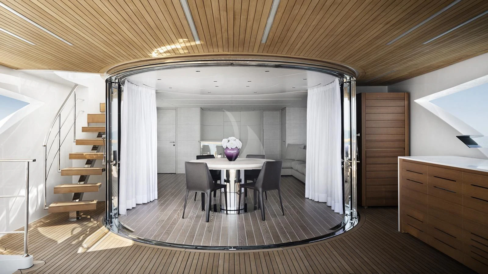 a large open room with a table and chairs aboard TINY WAVE Yacht for Sale