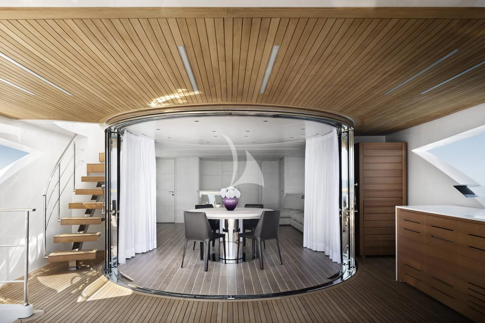 a room with a table and chairs aboard TINY WAVE Yacht for Sale