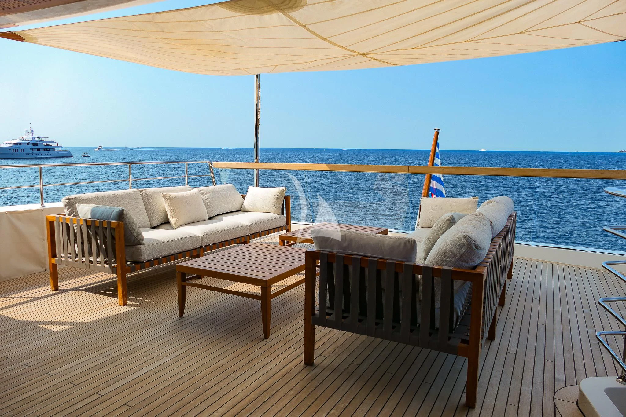 a porch with a table and chairs on it aboard TINY WAVE Yacht for Sale