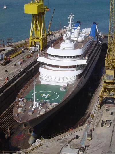 a large white ship docked aboard PRINCE ABDULAZIZ Yacht for Sale
