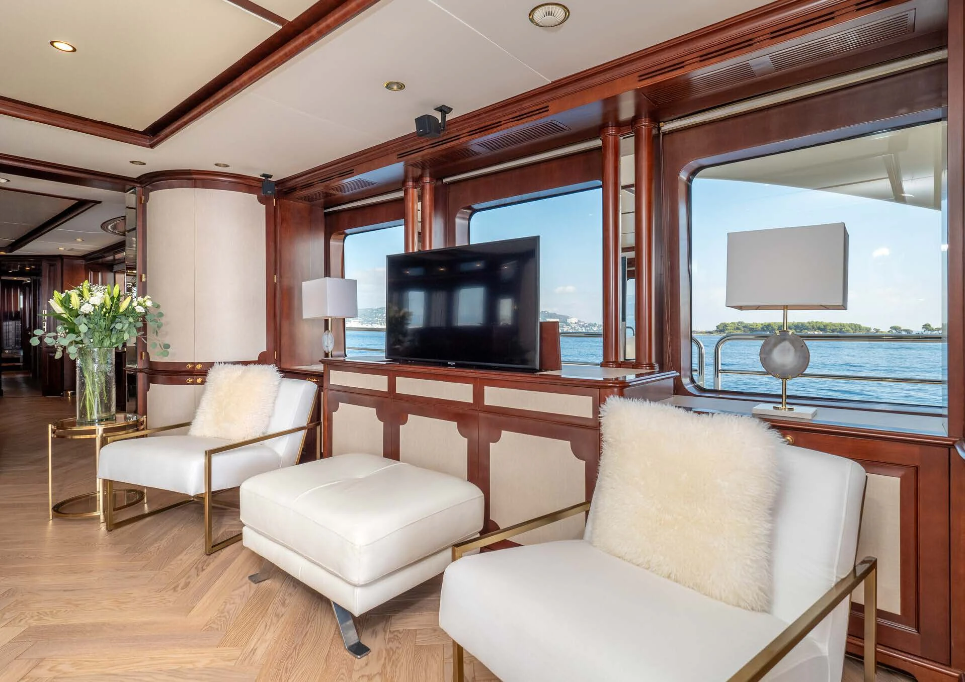 a living room with a large television aboard GIORGIA I Yacht for Sale