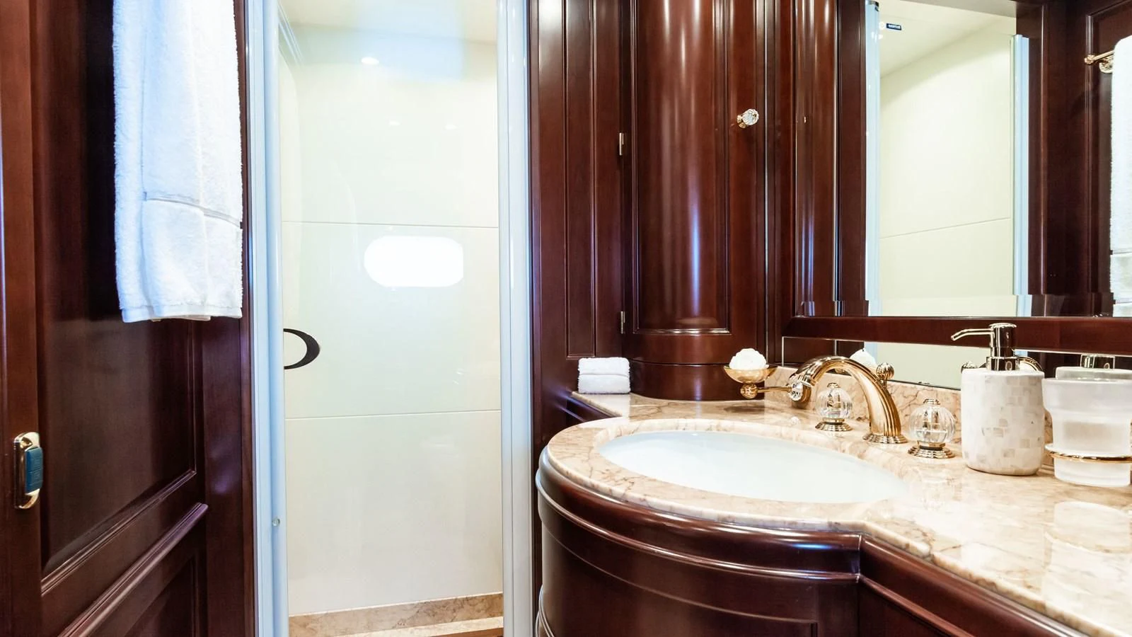 a bathroom with a sink and a mirror aboard GIORGIA I Yacht for Sale