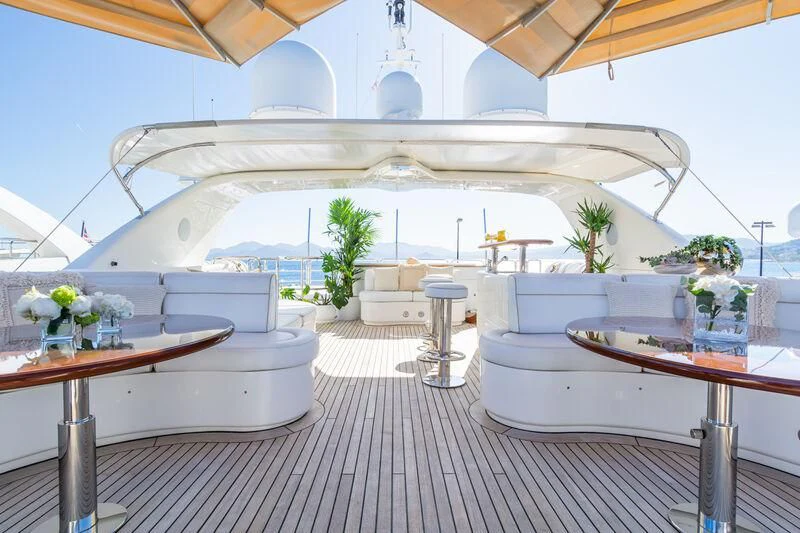 a room with a table and chairs aboard GIORGIA I Yacht for Sale