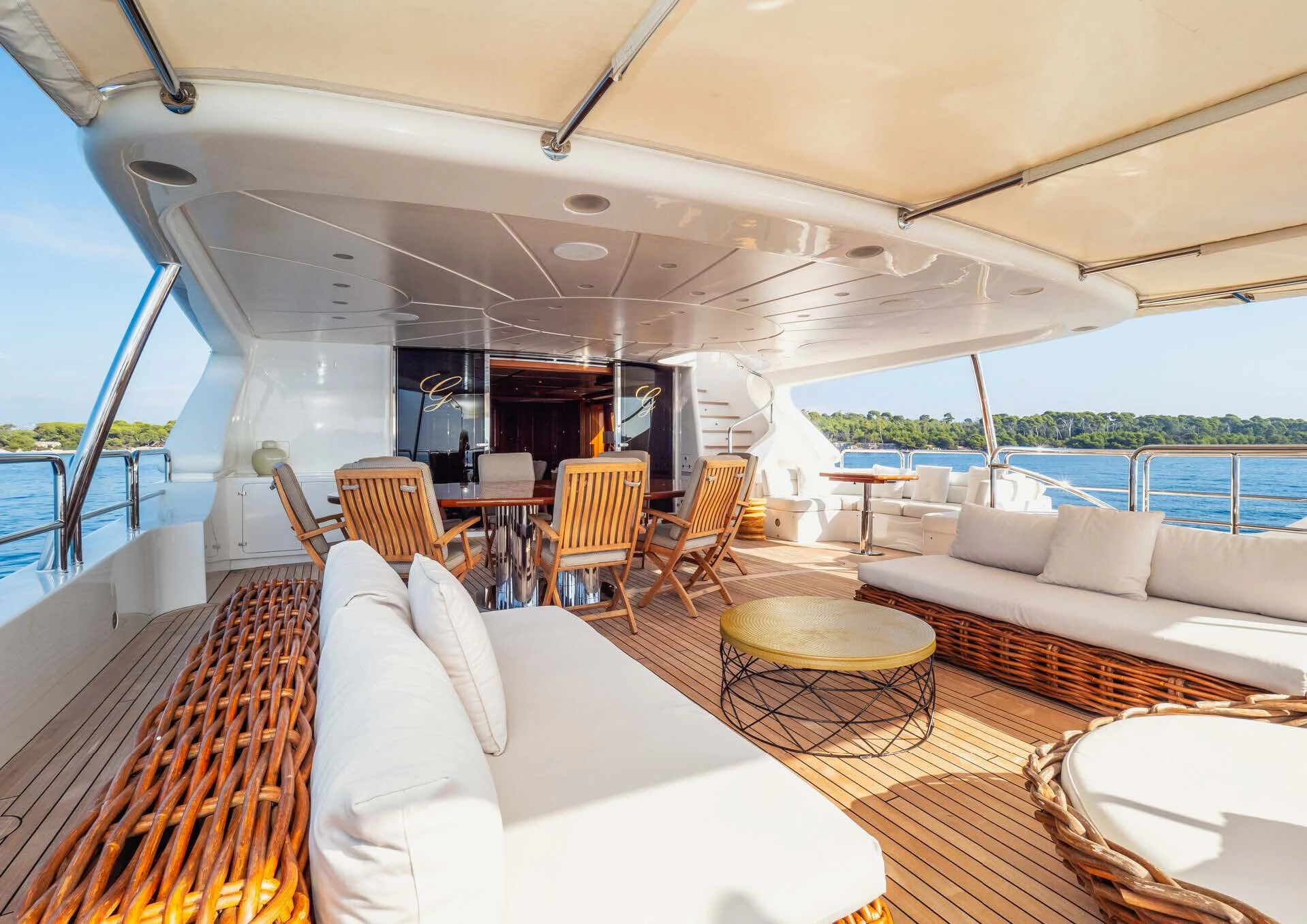 a boat with a table and chairs aboard GIORGIA I Yacht for Sale