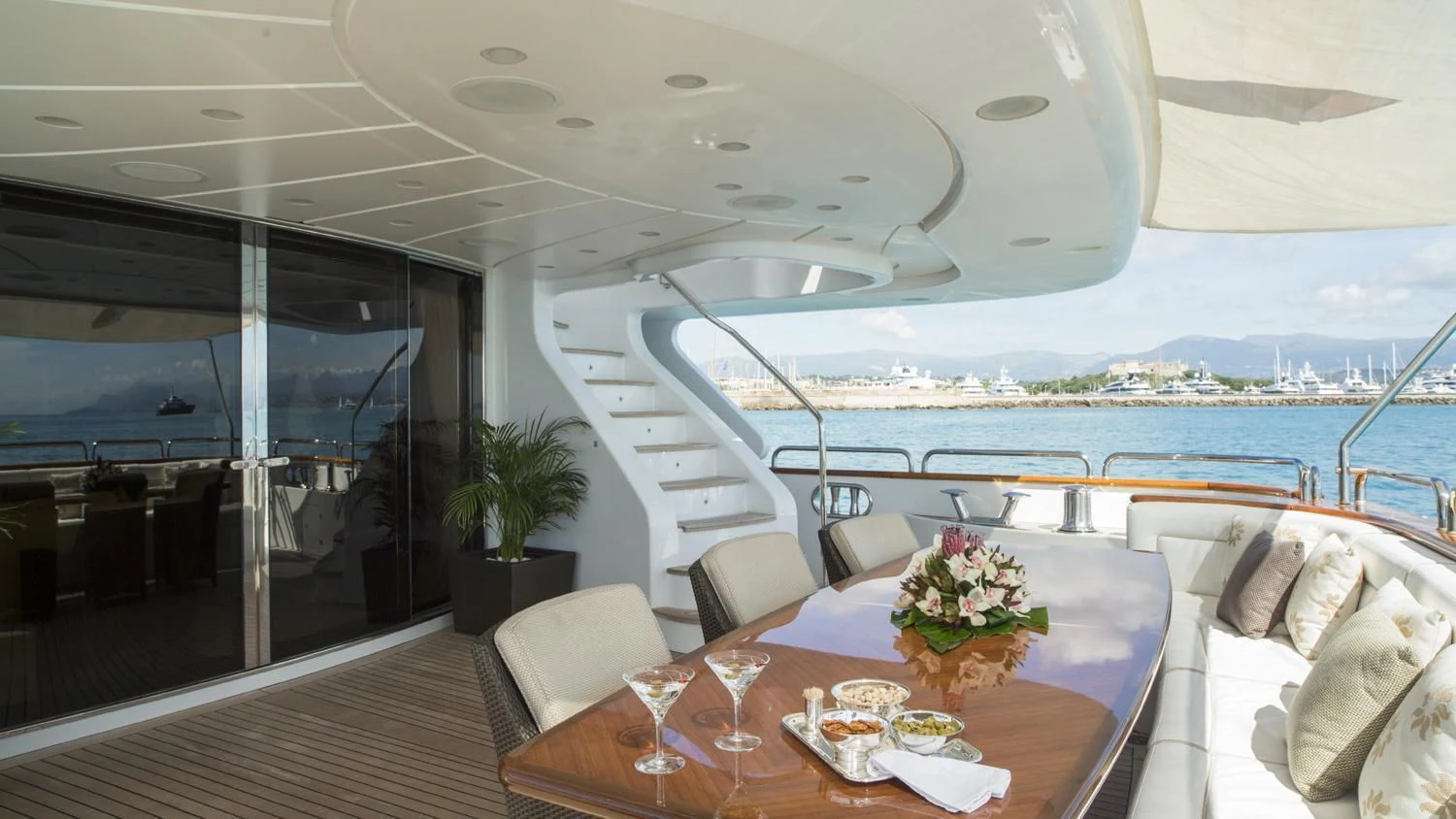a room with a table and chairs aboard GIORGIA I Yacht for Sale
