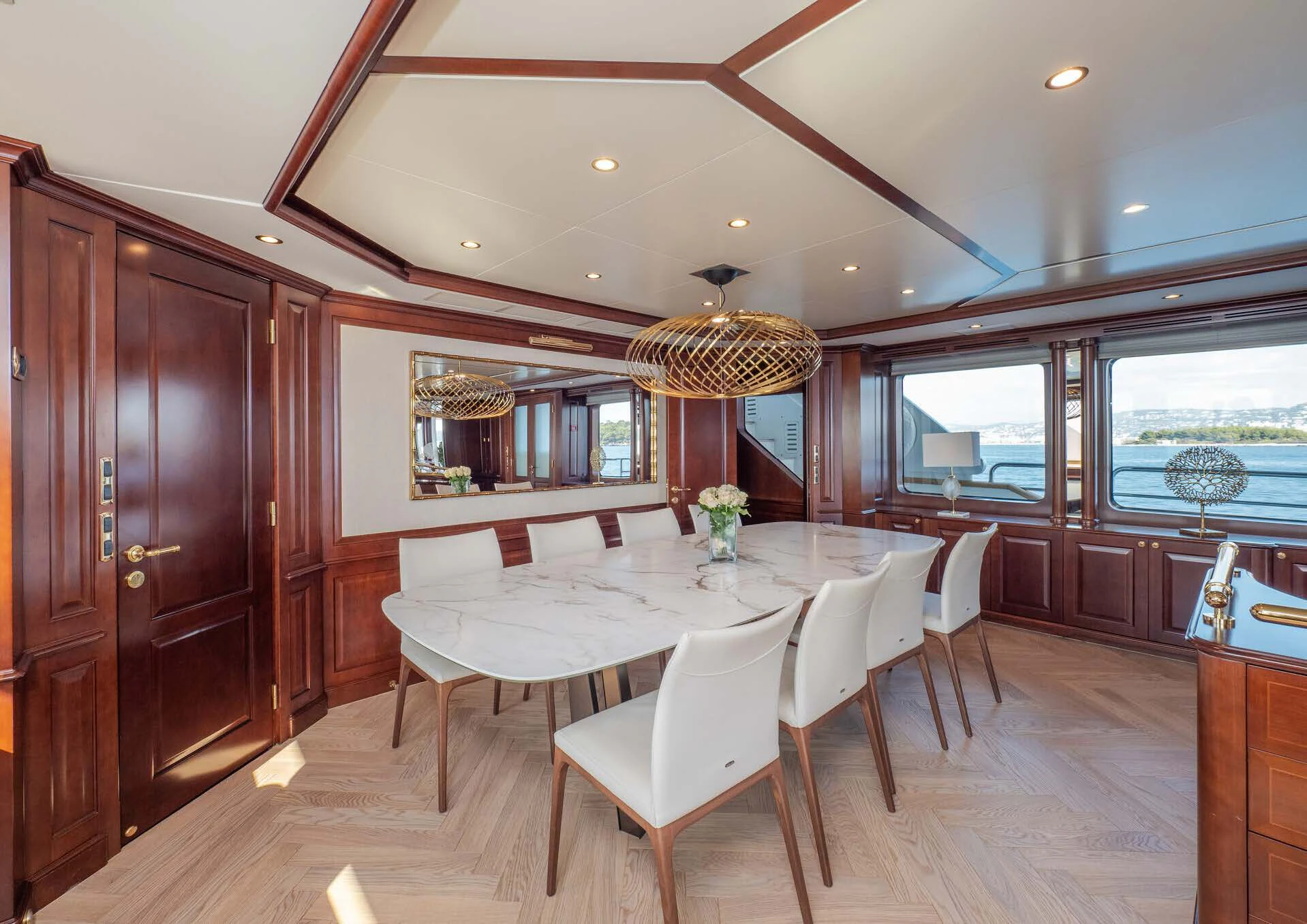 a dining room with a large window aboard GIORGIA I Yacht for Sale