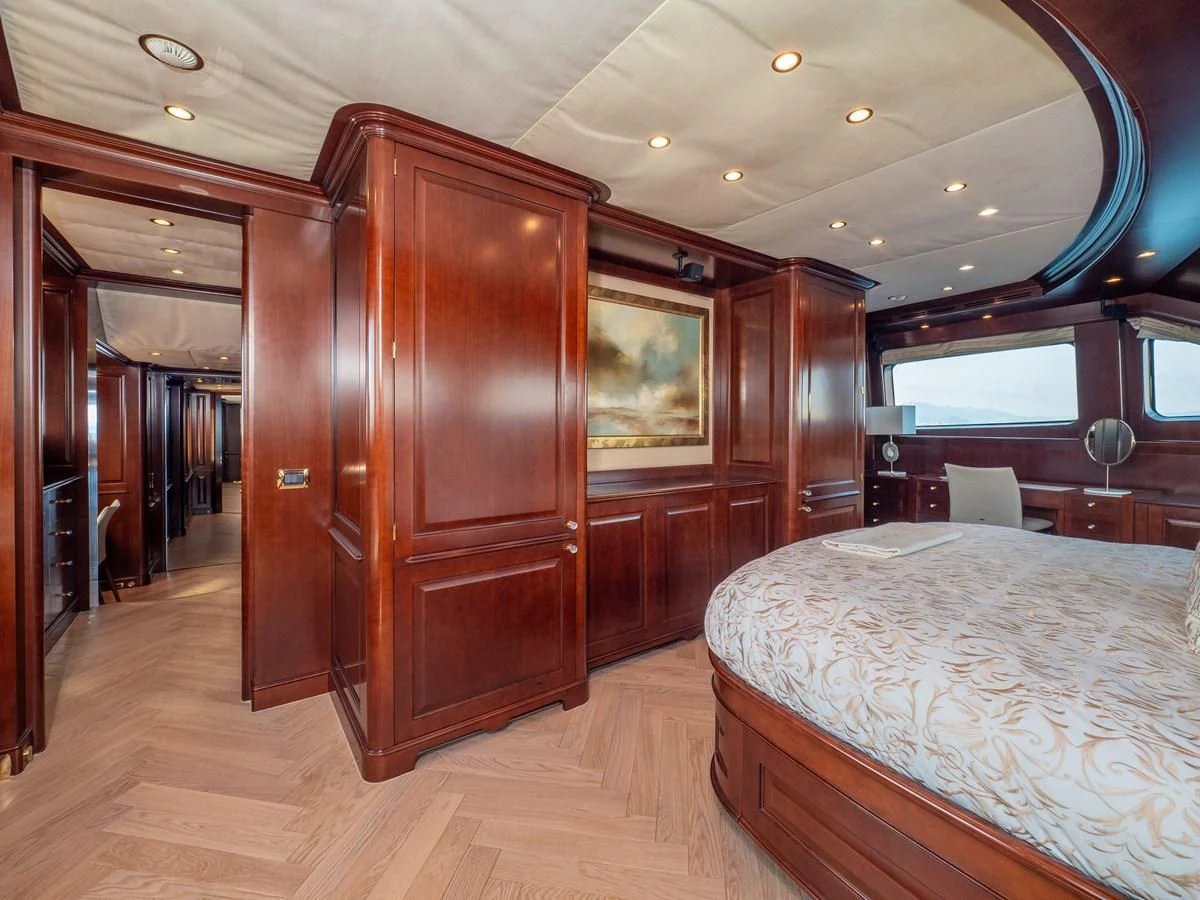a bedroom with a bed and a closet aboard GIORGIA I Yacht for Sale