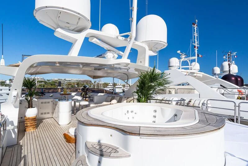 a large white boat with a white canopy and a white building with a white roof and a white aboard GIORGIA I Yacht for Sale
