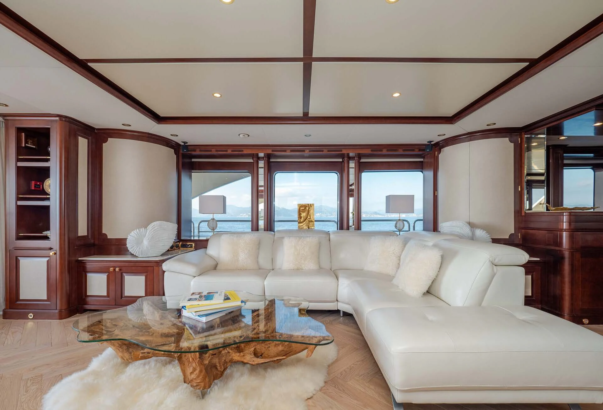 a living room with a couch and a coffee table aboard GIORGIA I Yacht for Sale