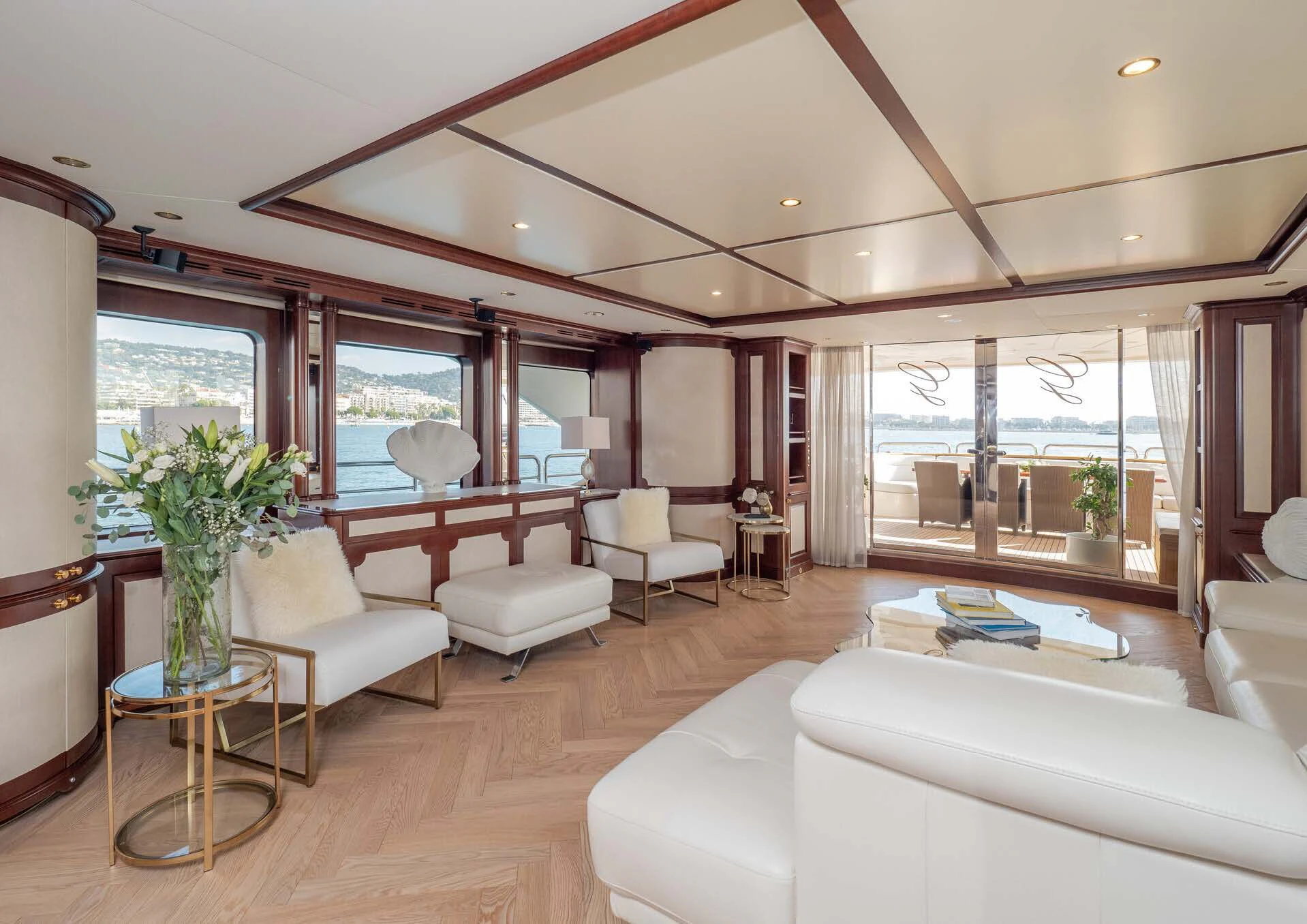 a living room with a large window aboard GIORGIA I Yacht for Sale