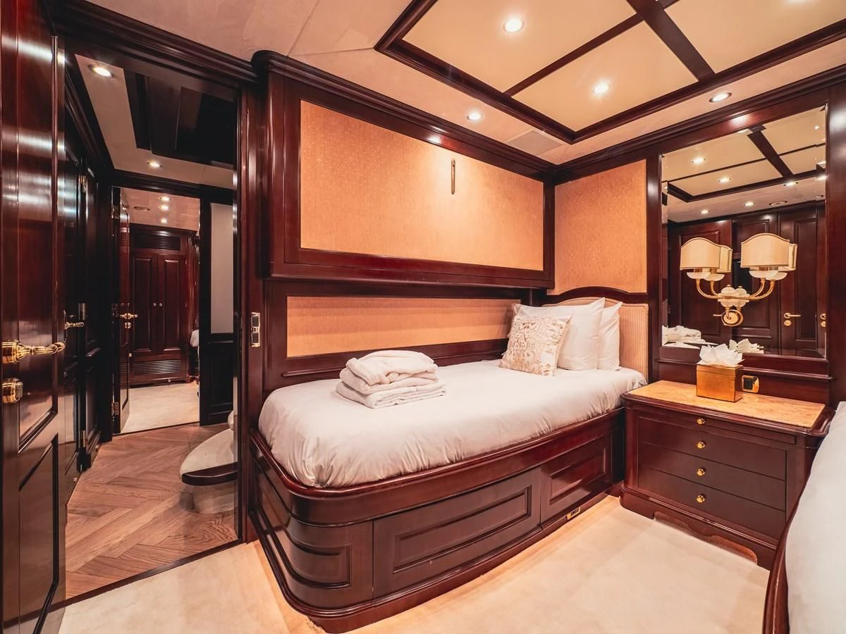 a bedroom with a large mirror aboard GIORGIA I Yacht for Sale