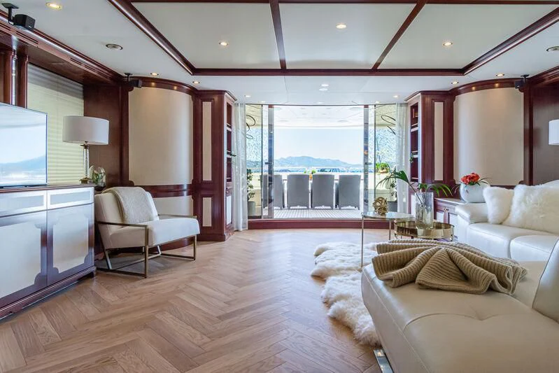 a living room with a large window aboard GIORGIA I Yacht for Sale