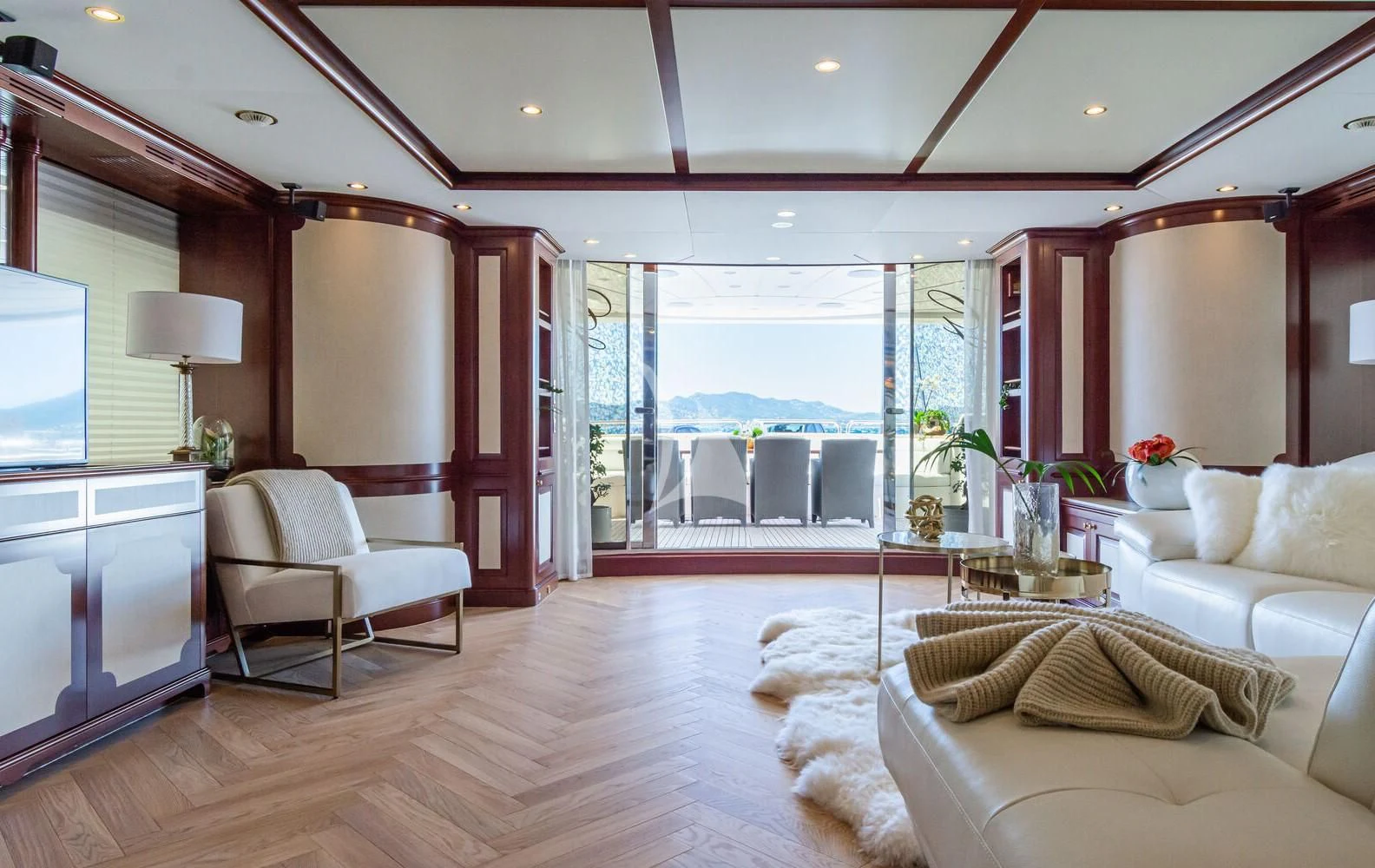 a living room with a large window aboard GIORGIA I Yacht for Sale