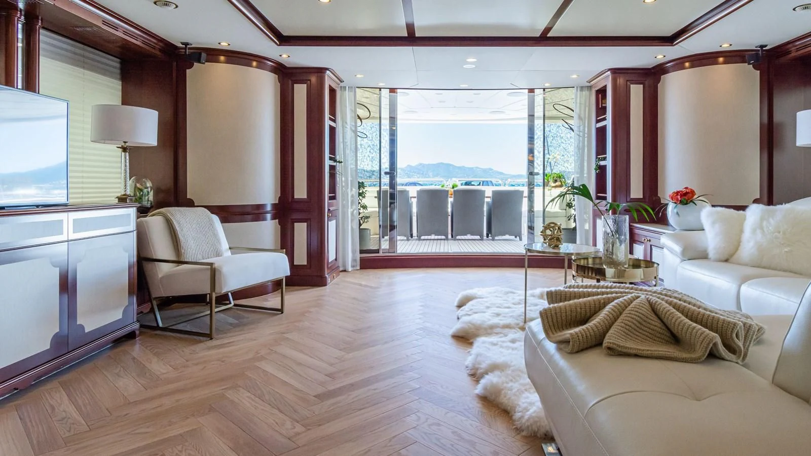a living room with a large window aboard GIORGIA I Yacht for Sale