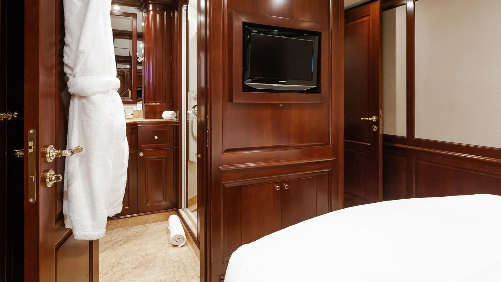 a room with a television and a closet aboard GIORGIA I Yacht for Sale