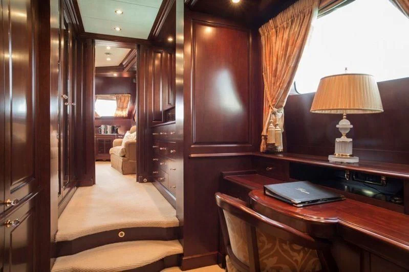 a room with a desk and a lamp aboard GIORGIA I Yacht for Sale