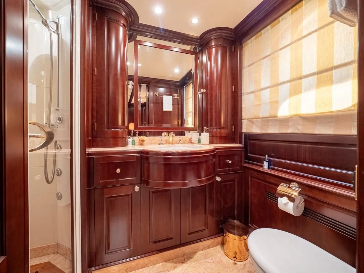 a bathroom with a sink and a mirror aboard GIORGIA I Yacht for Sale