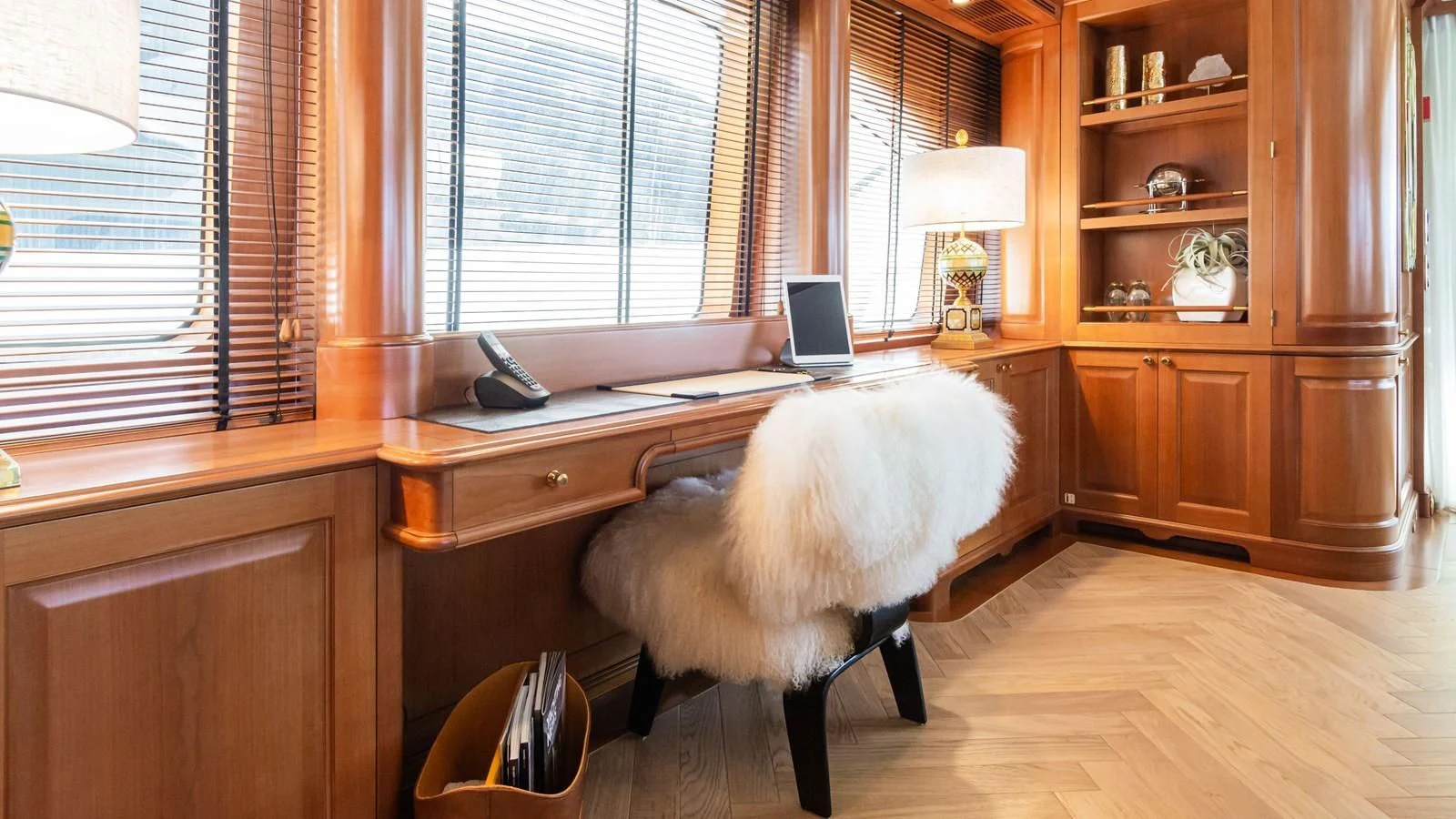 a dog sitting at a desk aboard GIORGIA I Yacht for Sale