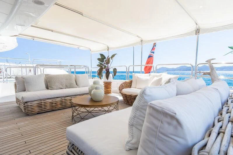 a large white tent with a couch and a table aboard GIORGIA I Yacht for Sale