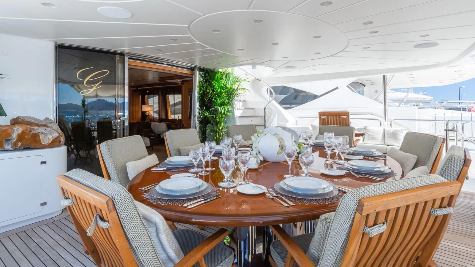 a dining room with a table set for a dinner aboard GIORGIA I Yacht for Sale