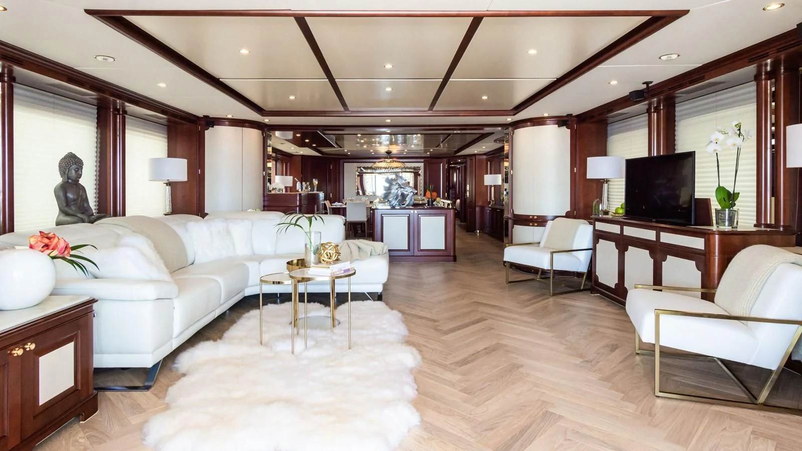 a living room with a large wood ceiling and a large television aboard GIORGIA I Yacht for Sale