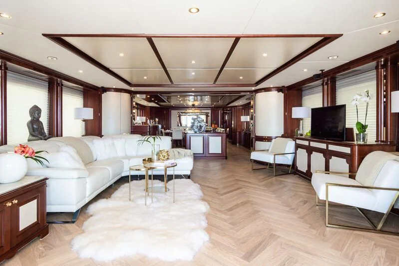 a living room with a large wood floor aboard GIORGIA I Yacht for Sale