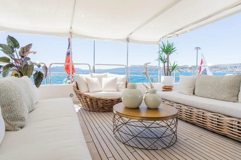 a living room with a large window aboard GIORGIA I Yacht for Sale