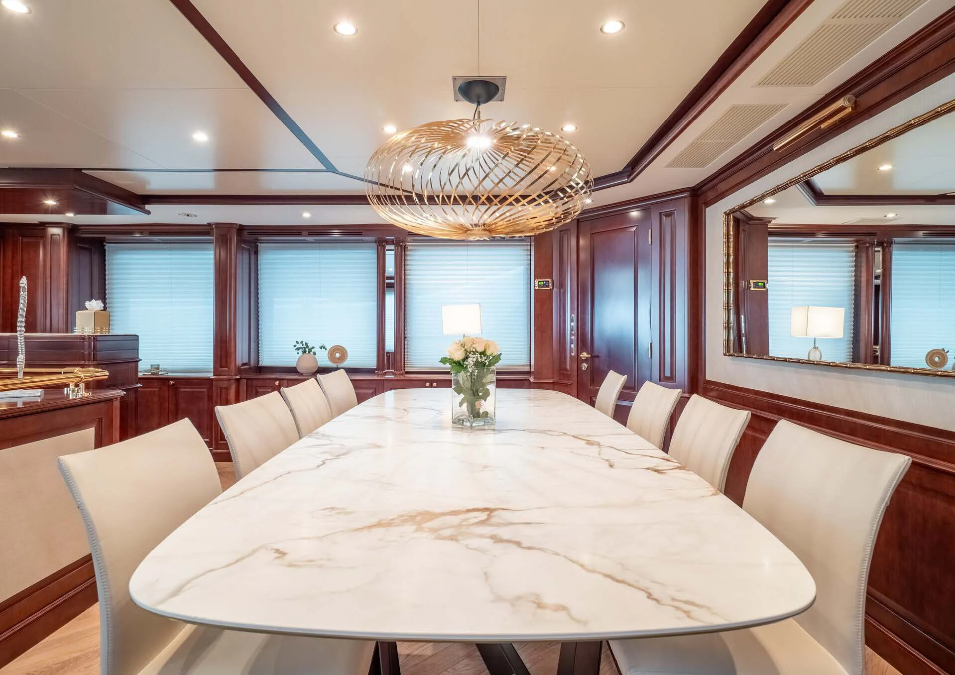 a large room with a large white table and chairs aboard GIORGIA I Yacht for Sale