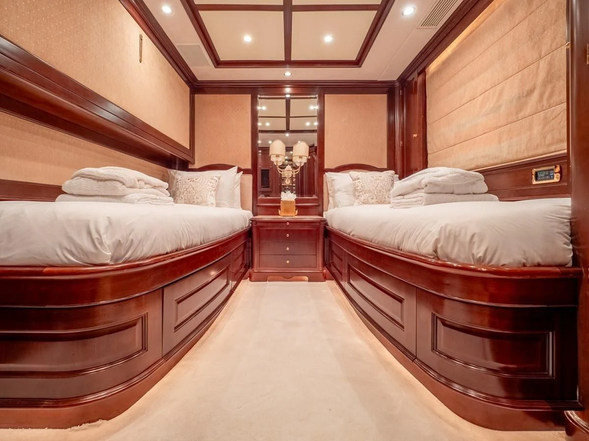 a room with a couple of beds aboard GIORGIA I Yacht for Sale