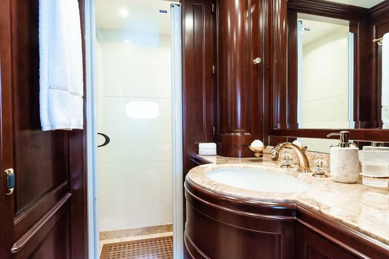 a bathroom with a sink and a mirror aboard GIORGIA I Yacht for Sale