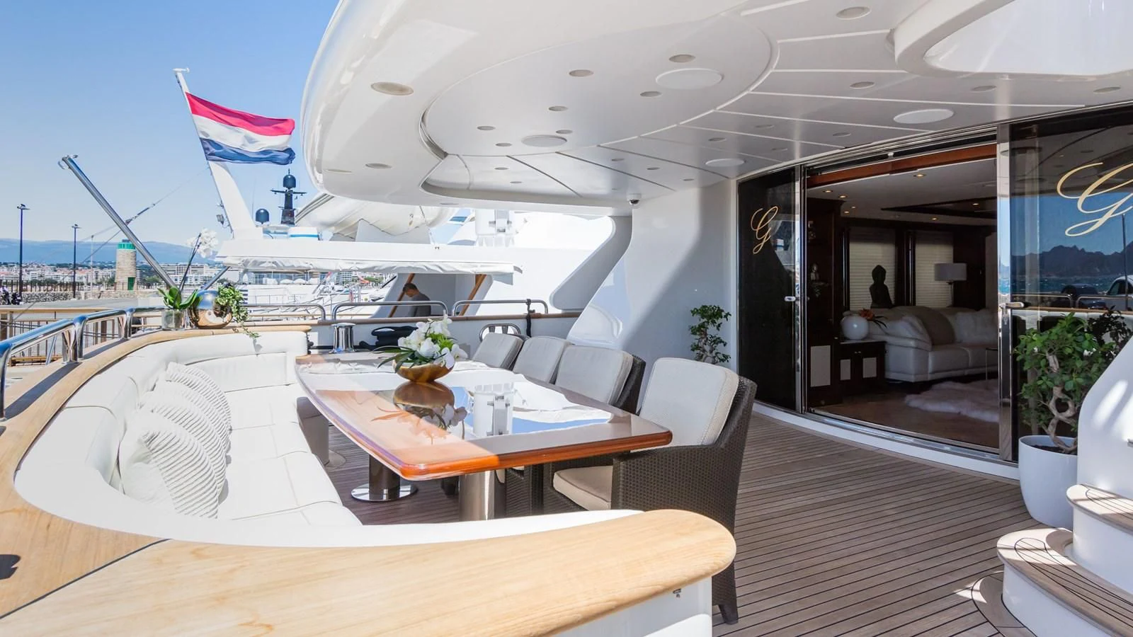 a room with a table and chairs aboard GIORGIA I Yacht for Sale