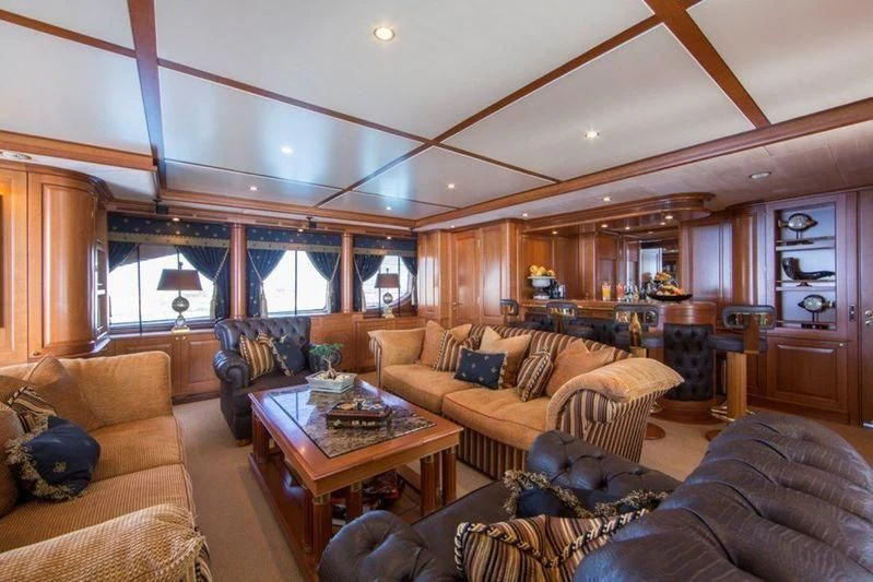 a living room with a fireplace aboard GIORGIA I Yacht for Sale