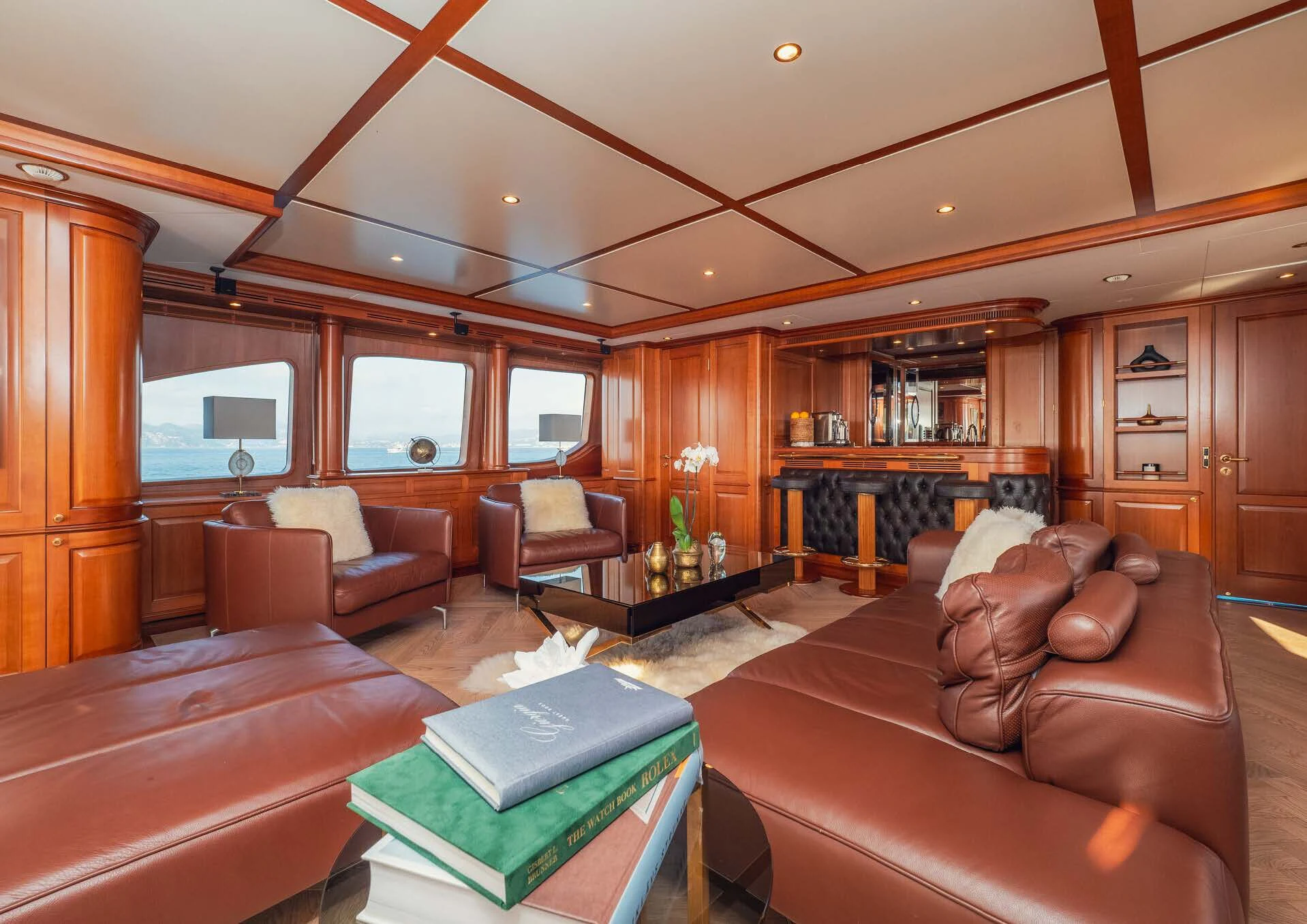 a living room with leather couches aboard GIORGIA I Yacht for Sale