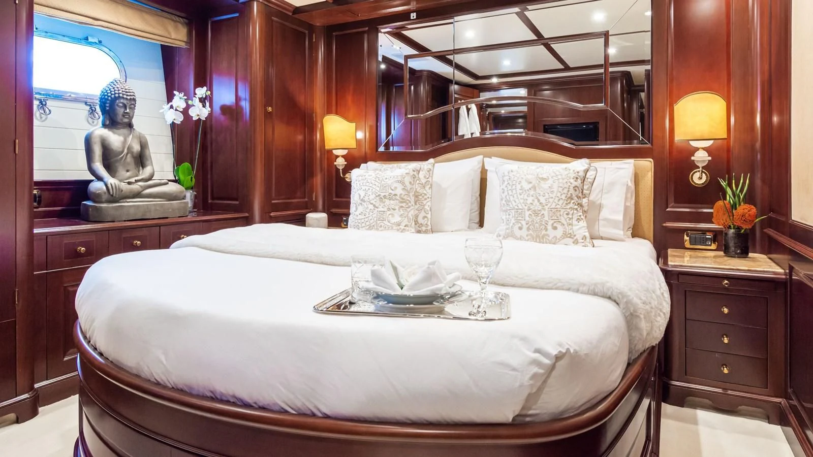 a bed with a white sheet and a tray of food on it aboard GIORGIA I Yacht for Sale